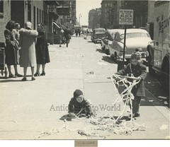 New York City children playing w paper on street vintage art photo by T. Hollowa