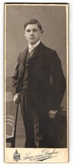 Photograph Jean van Daalen, Aalen, Bahnhofstrasse, boy in elegant suit with