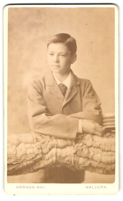 Photograph Norman May, Malvern, Boy in Suit with Arms Crossed