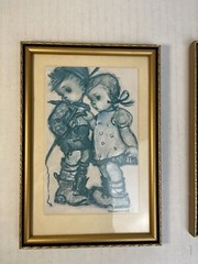 (2) Hummel characters photo prints in case in a 7 1/2” H x 5 1/4” W frame