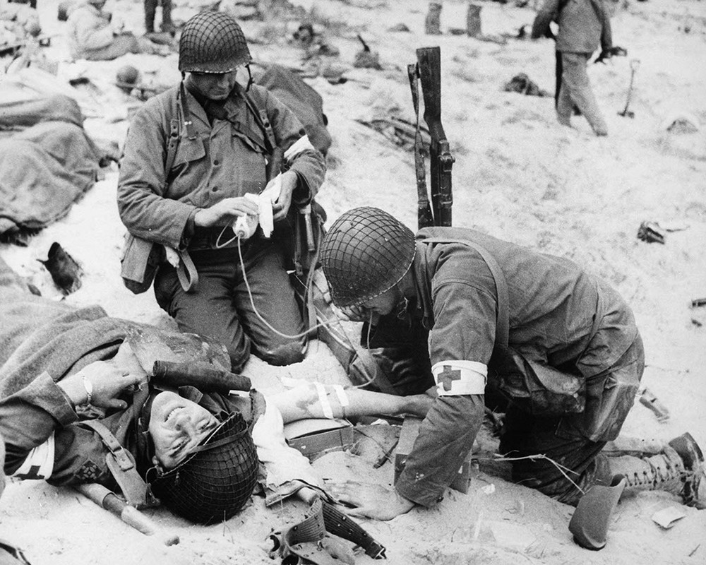 Medics helping injured soldier in France, 1944 8×10 Photograph Print 8″x10″