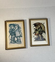 (2) Hummel characters photo prints in case in a 7 1/2” H x 5 1/4” W frame