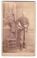 Photograph of a non-commissioned officer in uniform with a saber