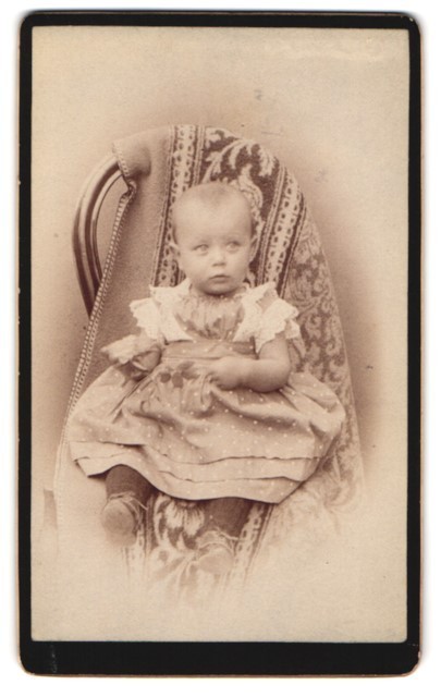 Photography of a toddler on a chair