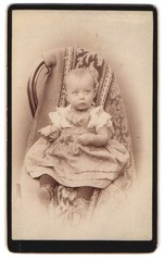 Photography of a toddler on a chair