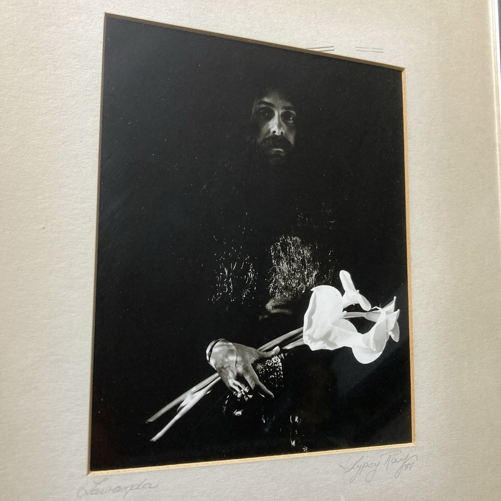 Lawanda Black And White Photography Of Man Holding White Flowers By Gypsy Ray