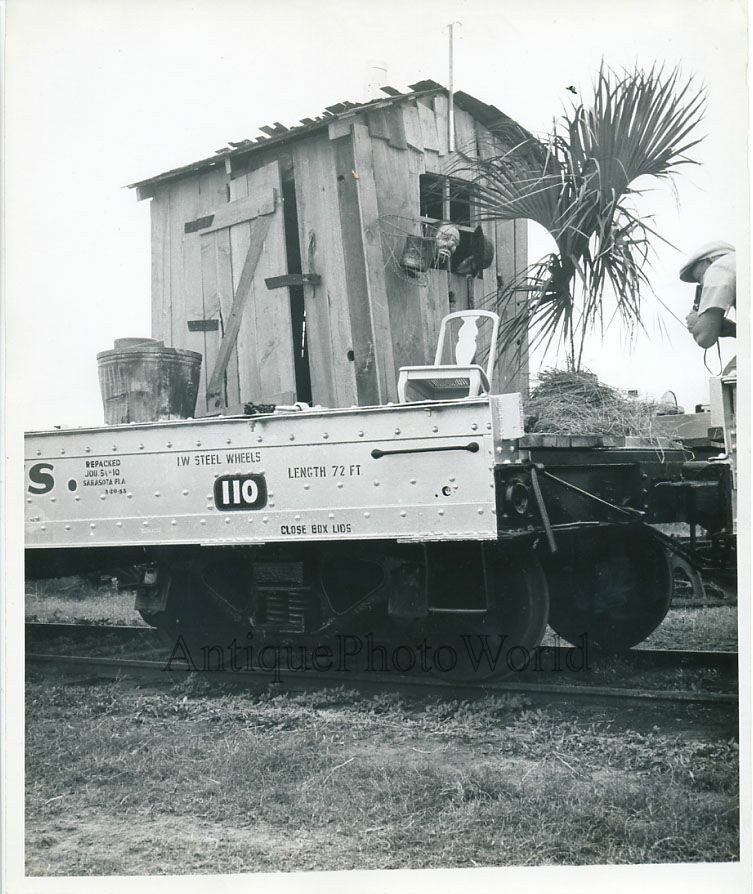Train carrying barn with clown vintage circus photo