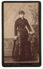 Photograph G. Hötzel, Aalen, portrait of a woman in elegant wardrobe next to egg